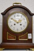 A good mahogany and brass mantel clock, the dial signed T Martin, London.