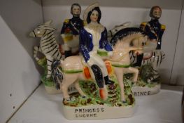 Three Staffordshire flat back figures.
