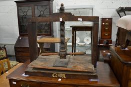 A George III fruit wood clothes press with screw thread operation, the base with carved GR cypher.