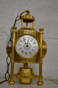 A reproduction brass three dial clock/barometer/thermometer.