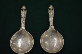 A pair of unusual Continental silver spoons with figural handles (28).