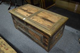An Eastern brass bound hardwood trunk.