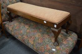 A mahogany long stool.