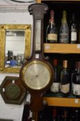 An oak cased barometer/thermometer.