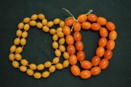 Two bead necklaces, possibly amber.