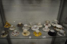 A collection of cabinet cups and saucers.