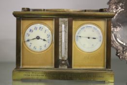 A brass combination carriage clock, barometer and thermometer.