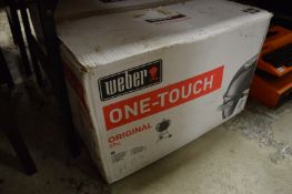A Weber barbecue, boxed and unopened.