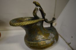 A classical bronze ewer or rhyton.