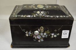 A Victorian papier mache two division tea caddy.