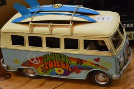 Tin plate model of a surfer camper van.