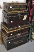 Four black japanned and gilt metal storage and cash boxes.