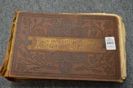 An old stamp album and contents.