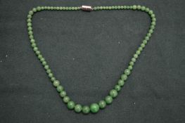 A jade bead necklace.
