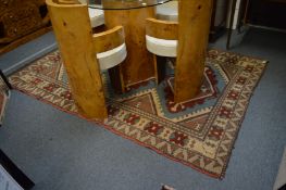 A Turkish rug, 240cm x 165cm.