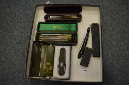 Two cased sets of cut throat razors and other items.