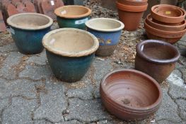 Six various plant pots.