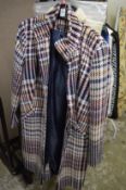A ladies dog toothed style check coat.