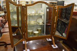 A folding dressing table mirror.