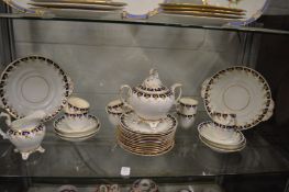 Decorative gilt and blue tea ware.