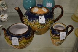 A Royal Doulton three piece tea service comprising teapot, sugar bowl and cream jug.