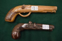 Two unusual salt glazed pottery models of flintlock pistols.