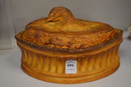 An earthenware game pie dish.