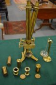 J H Steward, London, brass binocular microscope with accessories.