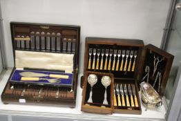 Oak cased canteen of cutlery and other plated items.