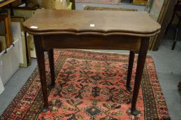 George III mahogany fold-over tea table of shaped outline on cabriole legs.