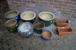 A quantity of decorative plant pots.