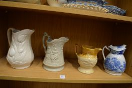 Four decorative jugs.