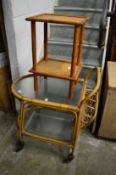 A 1960's bamboo and frosted glass two tier drinks trolley and a bamboo table.