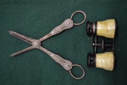 Grape scissors and opera glasses.