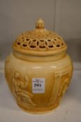 A potpourri jar with cover and liner, the body decorated with classical figures.