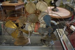 Three early electric fans.