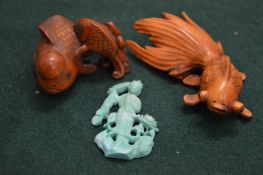 Two Japanese wood fish netsuke's and another item.