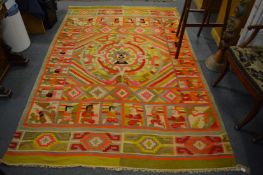 An unusual pictorial Kilim carpet decorated with figures, 255cm x 170cm.