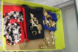 A quantity of decorative necklaces with matching earrings etc.