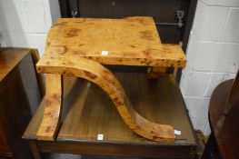 An unusual Art Deco style burr wood coffee table with curving legs.