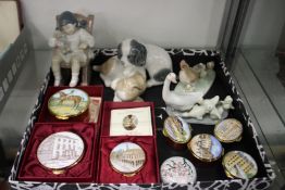 Decorative china ornaments and enamel boxes.