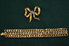 A decorative brooch and a diamante bracelet.