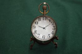 A ball clock and barometer.