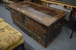 A good Eastern brass bound hardwood trunk with brass studded decoration and three drawers to the