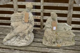 Two reconstituted stone garden ornaments modelled as a man and a women seated on a bench.