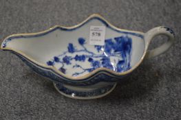 A 19th century Chinese blue and white porcelain sauce boat.