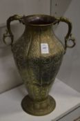 A good Islamic embossed and chased twin handle vase.