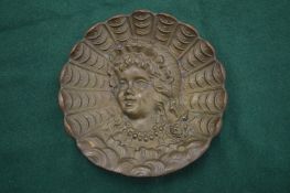 A small cast bronze dish.