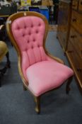 A Victorian style button upholstered nursing chair.