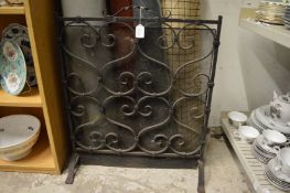Wrought iron fire guard.